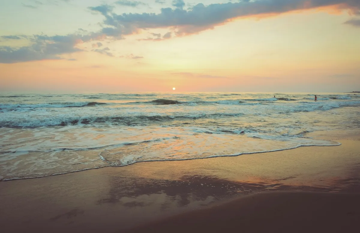 Gentle surf on a sunlit beach