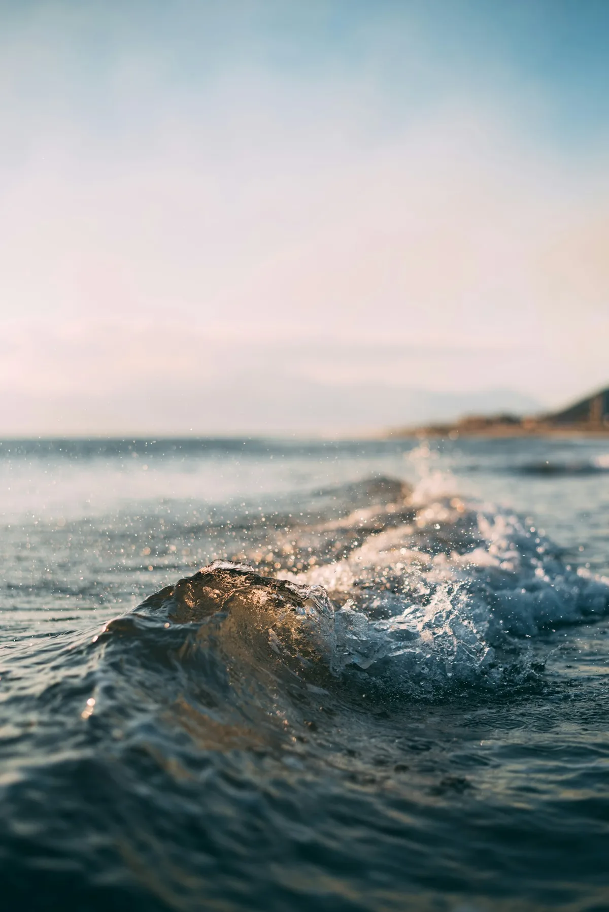 Sea spray and waves along a rocky shore